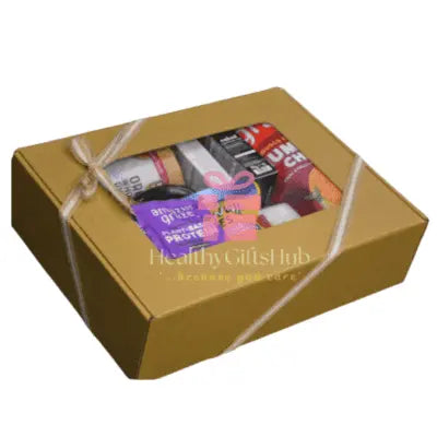 Rustic gift box with healthy snacks and treats, tied with ribbon